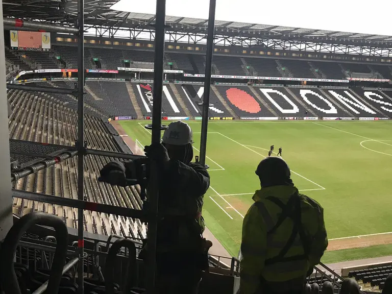 Our scaffolders building an access scaffold in the stands at MK Dons Stadium, Milton Keynes